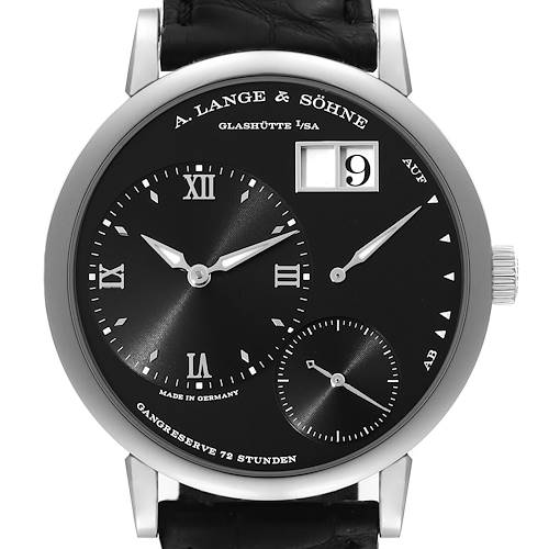 The image shows a front view of the Lange 1 model watch by A. Lange & Söhne, featuring a black dial with Roman numerals and a leather strap.