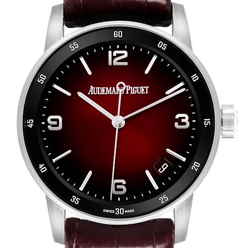 The image shows a Audemars Piguet Jules model 15210BC men's watch from a front angle, highlighting its deep red dial, silver markers, and leather strap.