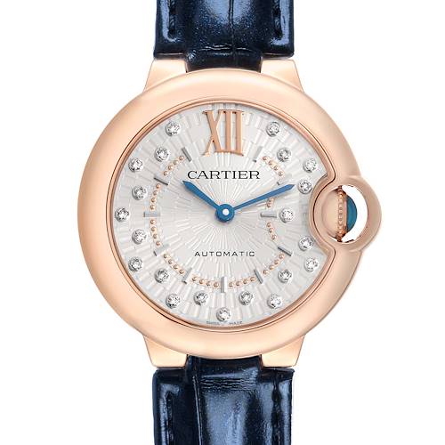 The Ballon Bleu de Cartier watch is shown from a front angle, highlighting the face, crown, and strap.