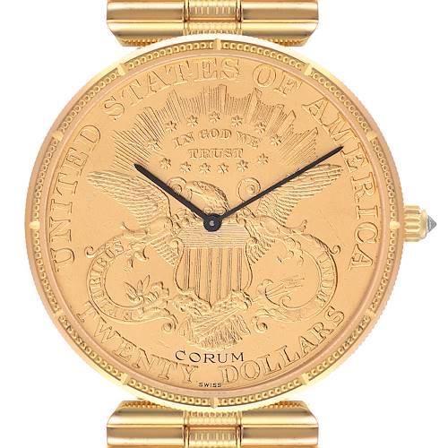 This image shows the face of a Corum Coin Watch 1898 Men's Yellow Gold Champagne Dial 1898 Men's Yellow Gold Champagne Dial model with its hour and minute hands, bezel, and part of the bracelet.