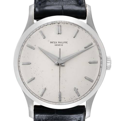 The image shows a frontal view of a Patek Philippe Calatrava 570 Men's White Gold Silver Dial watch, highlighting its face, dial, and leather strap.