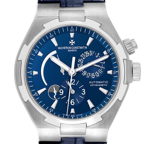 The Vacheron Constantin Overseas 47450 Men's Stainless Steel Blue Dial watch is shown from a front view, highlighting the blue dial, hands, subdials, and crown.